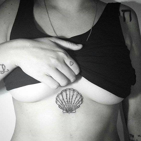 36 Of The Coolest Ideas For Between-The-Boobs Tattoos We've Ever Seen