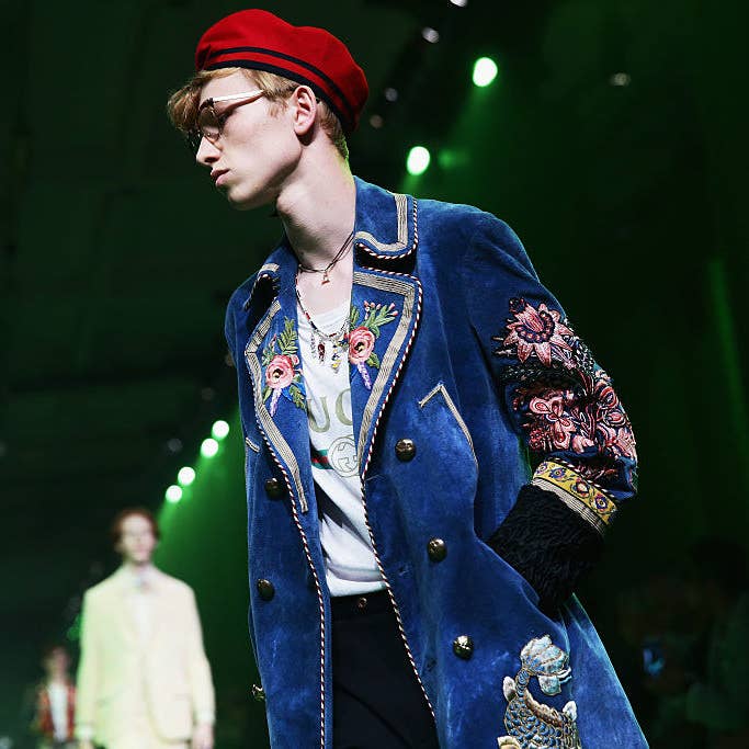 Milan Fashion Week: Models carry fake heads on Gucci catwalk - BBC