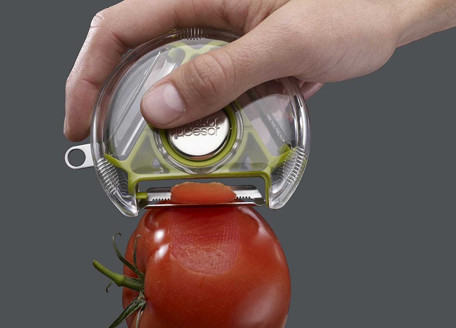A flat cylindrical vegetable peeler with an open end to expose the desirable blade
