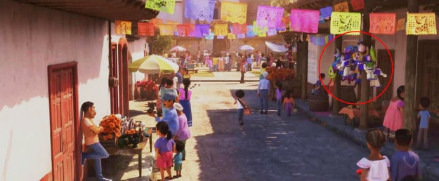 Also in Coco, Buzz, Woody, and Mike Wazowski can be seen as pinatas being sold by one of the street vendors.