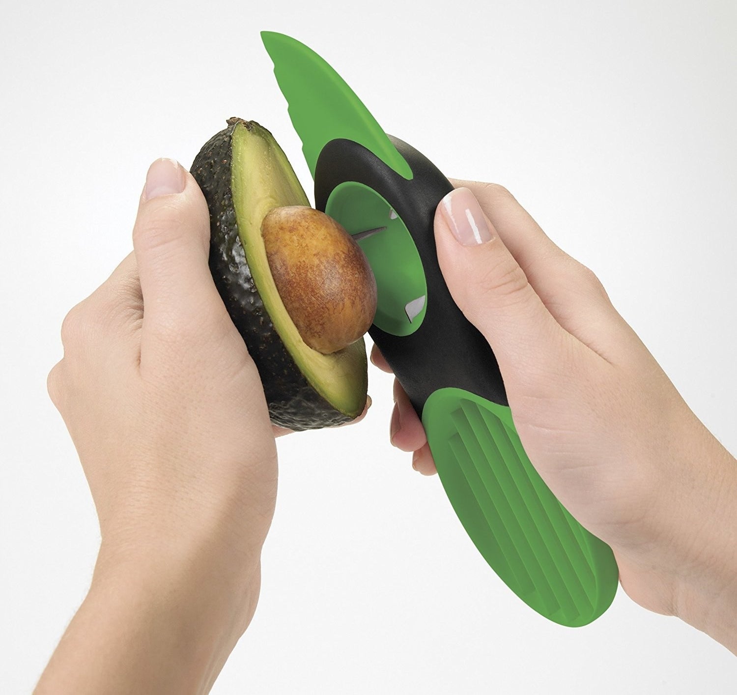 A tool with a knife on one end and a slicer on the other to scoop through the avocado. In the middle, there&#x27;s a inverted hemisphere to grasp and remove avocado pits