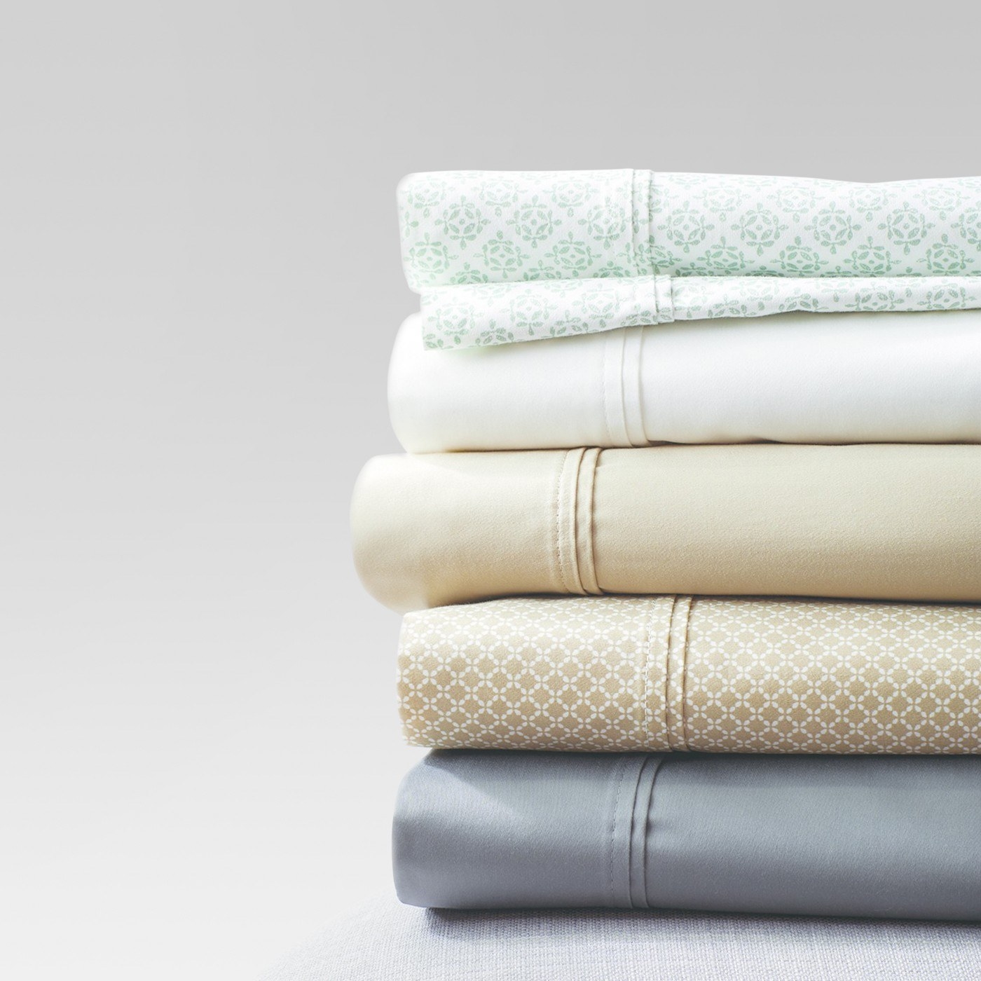 stack of sheets in different colors and patterns