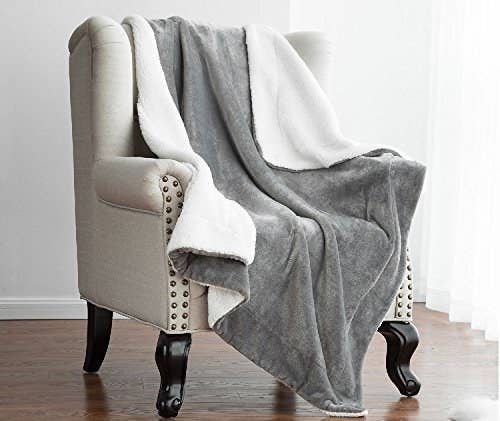 blanket with a color on one side and white faux-fleece on the other