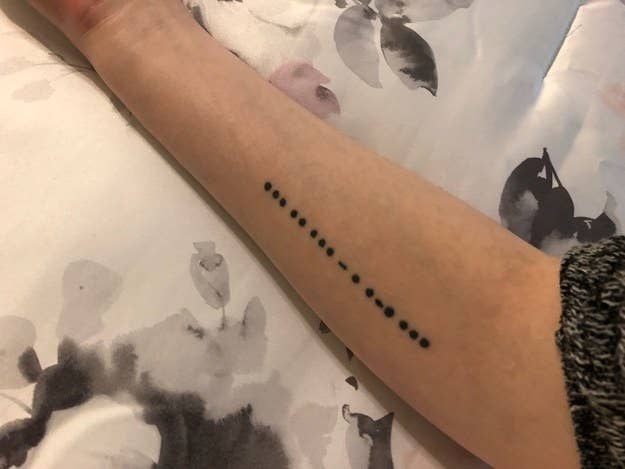 "My sisters and I are all very close, and we had been toying with the idea of getting matching tattoos, but hadn’t settled on anything. Two years ago, when one of my sisters left to go to college in another state, we decided to get 'sisters' written in Morse code. I have it on my arm because I carry them with me, my sister has it on her foot because she walks in our footsteps, and when my youngest sister turns 18, she’ll get it on her back because we always have her back." — liza4cffc3ca3