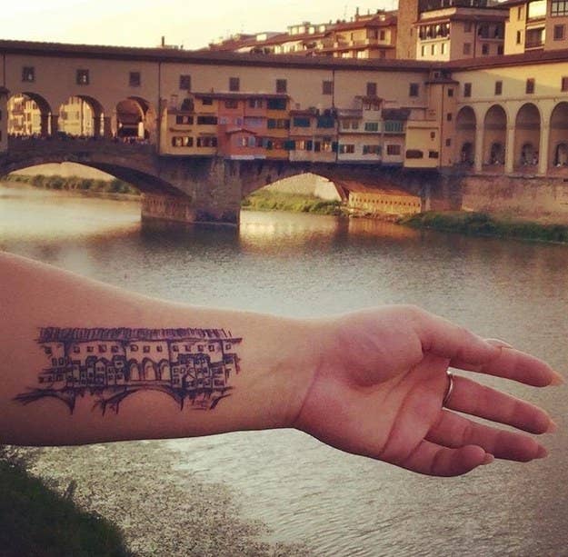 "I studied abroad as an Art Major in Florence and have visited a few times since. On my last visit I sat beside the Arno River and drew a sketch of the Ponte Vecchio, and got my sketch tattooed on my arm the next day. I love that my favorite city and a piece of my own art is always with me." — andread4378df17b