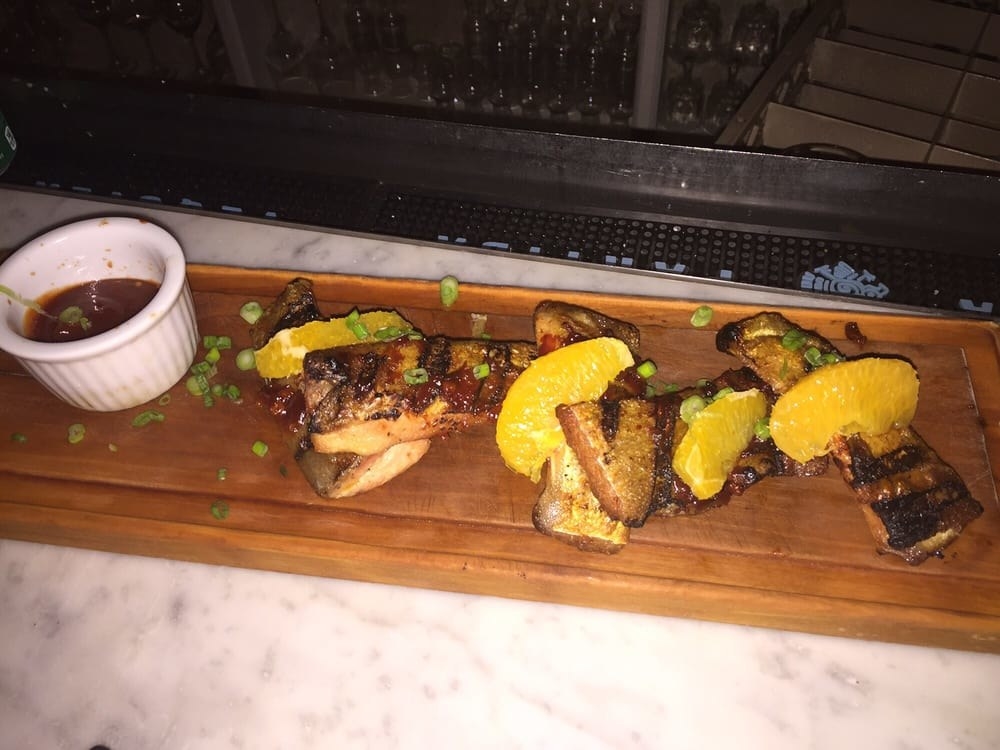 The Pacu Fish Ribs is an absolute must at La Pulperia, no matter how full you are. This grilled Brazilian fish ribs are rubbed in slightly spicy, orange chipotle BBQ sauce and served with a side of coconut rice.