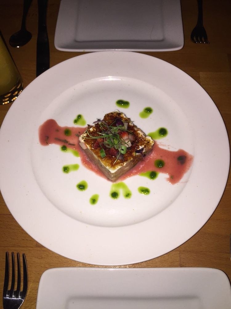 This unique dish called El Salmon Brulee features salmon tartare topped with fromage brulee and strawberry, ginger leche de tigre, and micro bull blood greens. Taste sweet and savory all at the same time with this amazing dish.