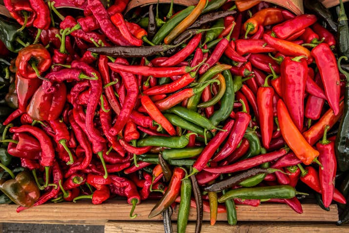 The burning sensation you experience all comes down to a chemical compound found in peppers called capsaicin. Capsaicin binds to pain receptors on your nerves, causing your brain and body to react in a similar way as if there was something hot in your mouth.