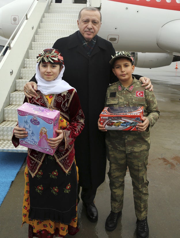 It was neither the first nor last the time Erdogan had taken photo ops with children dressed in Turkish military gear over the last few days. Here he is in the province of Sanliurfa on Sunday before another party speech.
