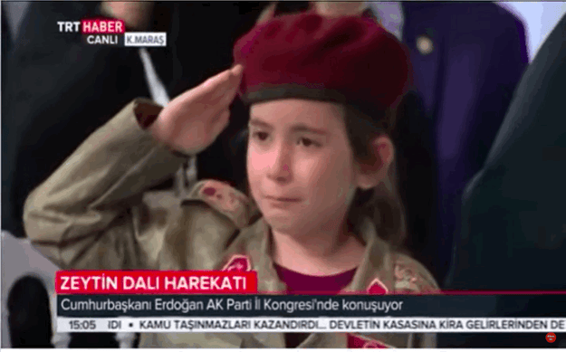 The girl, identified as a first-grader named Amine Tiras, did her best to hold her salute when first ID'd but absolutely broke down when the president called her onstage.