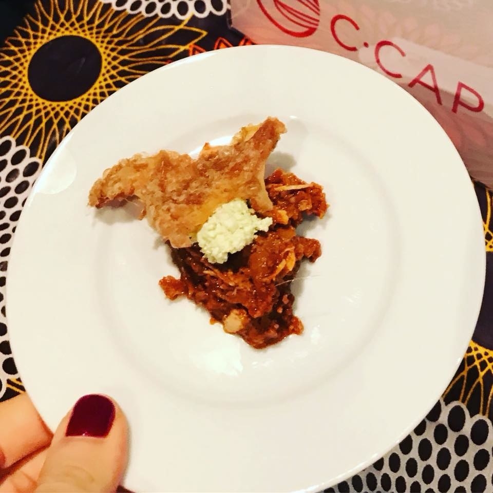 Layers of Ethiopian bread injera with chicken, paired with crispy skin and rosemary ayib