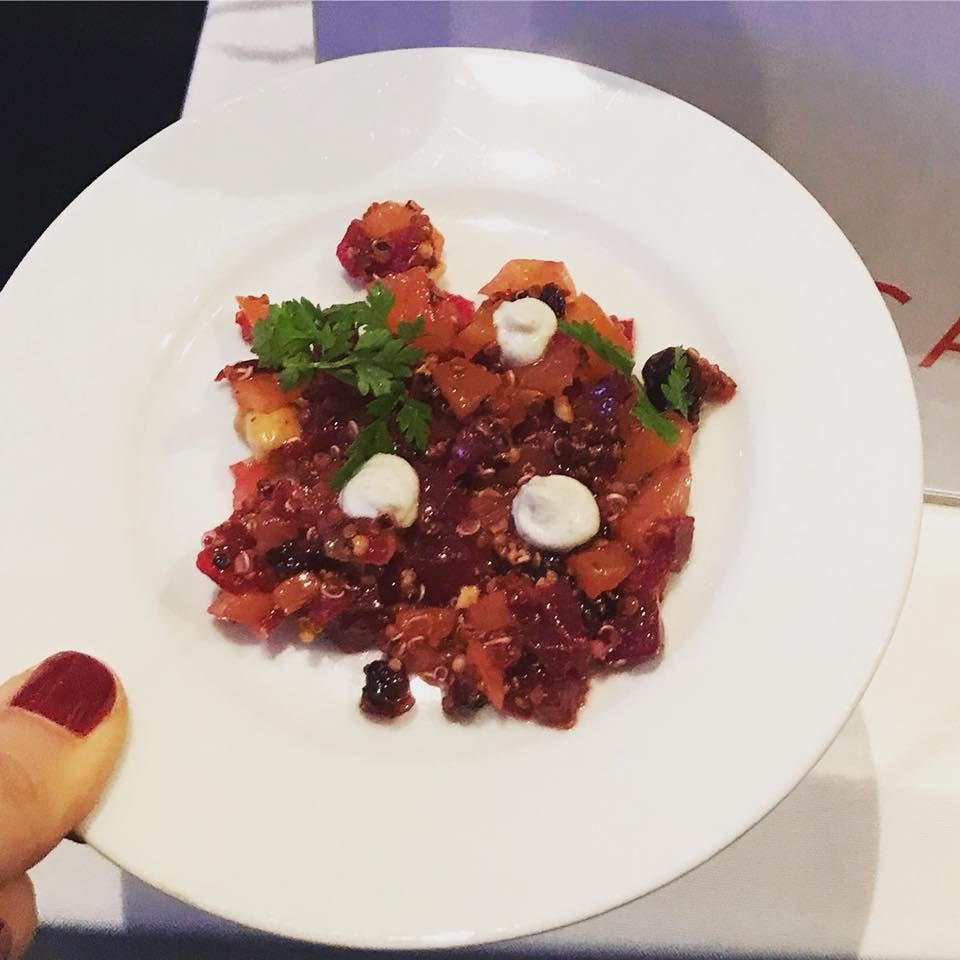 Cubes beet, pineapple, cherries, and mangoes with crunchy cashews and quinoa topped with five spice yogurt and micro greens