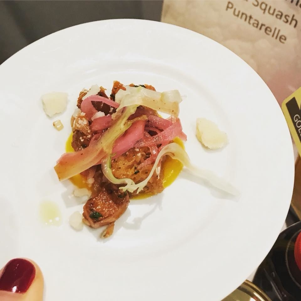 Cubes of crispy bread and roasted squash with pickled vegetables and cheese crumbs over squash puree