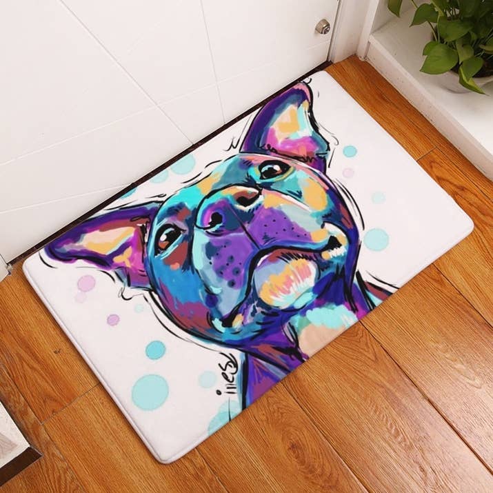 Promising review: "Looks just like our furbaby! The rug is not heavy duty, but I didn't want a heavy, thick rug that you might put in front of your door — just something for coming out of the shower or in front of the kitchen sink. I would buy another and recommend it." —WNCHeidiGet it from Amazon for $8.46+ (available in two sizes and 16 styles).