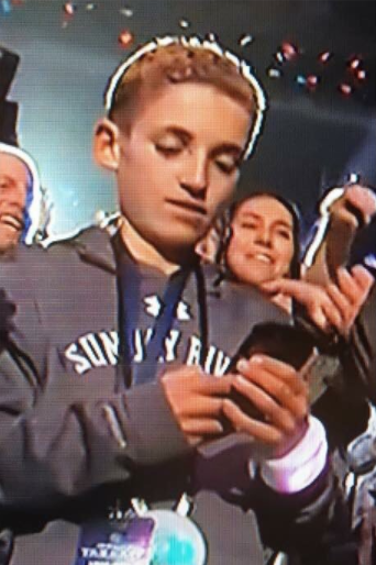 And then the kid started to play on his phone while on camera: