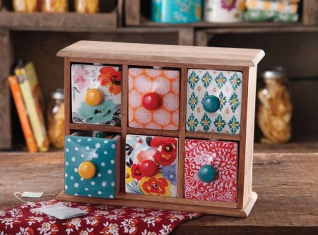 A rustic spice box with six separate drawers that can hold teas, condiments, or anything else that needs a fancy home.