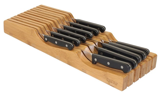 A bamboo knife organizer that fits perfectly in a kitchen drawer.
