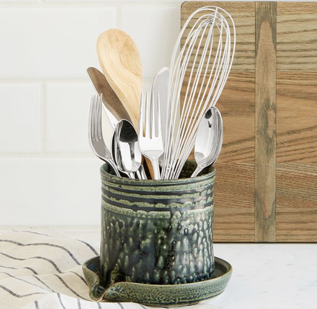 A handy utensil caddy that drains your freshly cleaned kitchen tools right into the sink.