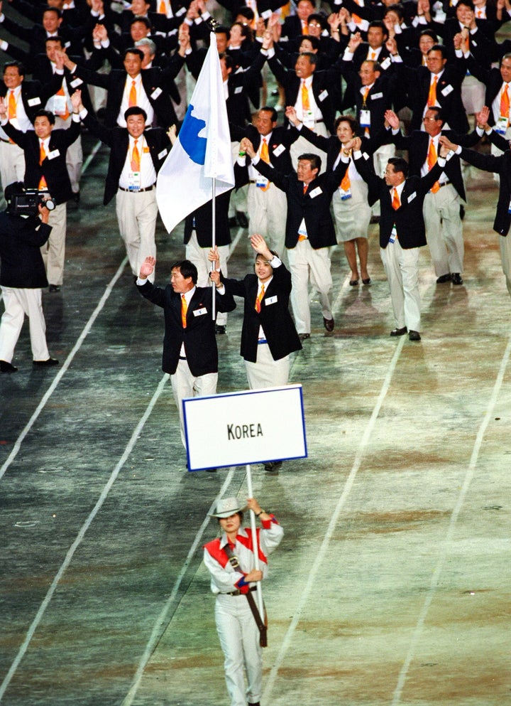 North and South Korea march under a single, unified banner in 2000.