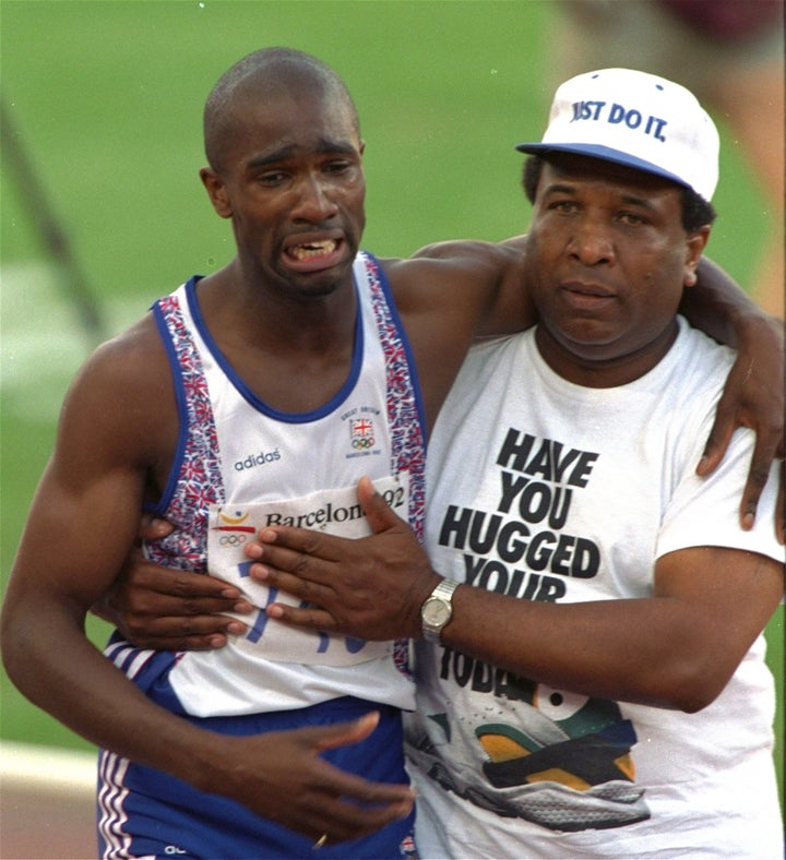 Britain's Derek Redmond is helped across the finish line by his father in 1992.