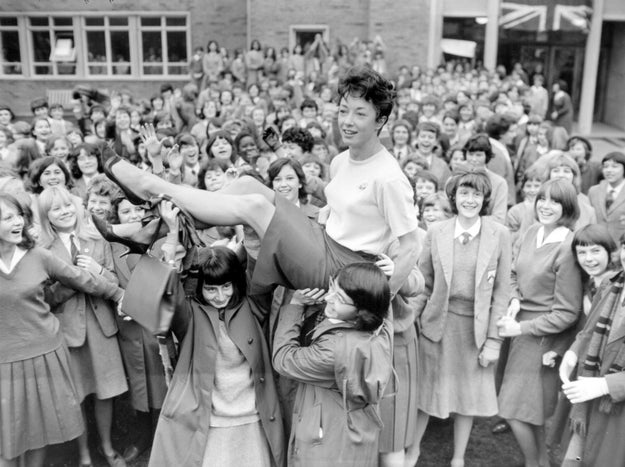PE teacher Ann Packer of Britain returns to her students as an Olympic champion in 1964.