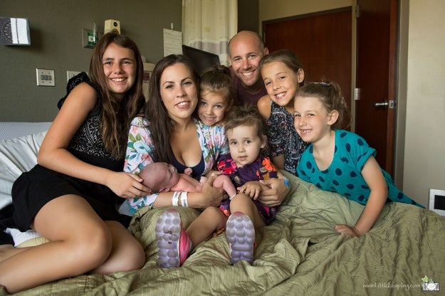 This is Jes and Travis Hogan of Manhattan, Kansas, surrounded by their five daughters and new son вЂ“ who entered the world in a very memorable way.