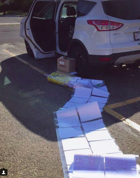 This teacher almost made it to their car without dropping everything:
