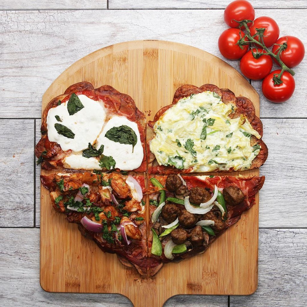 2 servingsINGREDIENTSPotato Heart Crust5 red potato1 teaspoon sea salt1 teaspoon garlic powder1 teaspoon black pepperClassic Toppings2 tablespoons tomato sauce35 g (1/3 cup) shredded mozzarella cheese115 g (4 oz) mozzarella cheese, sliced, to serve2 tablespoons fresh basil, rougly tornBBQ Chicken Toppings2 tablespoons tomato sauce35 g (1/3 cup) shredded mozzarella cheese35 g (1/3 cup) shredded cheddar cheese115 g (4 oz) mozzarella cheese, sliced, to serve1/8 red onion, thinly sliced1/2 barbecue chicken breast, 1/2 cooked, sliced2 tablespoons fresh parsley, finely chopped1 bacon strip, finely choppedSupreme Combo Toppings2 tablespoons tomato sauce35 g (1/3 cup) shredded mozzarella cheese1 pepperoni1 Italian sausage, diced1 mushroom, thinly sliced1/8 white onion, thinly sliced 1/8 green pepper, thinly slicedSpinach Artichoke Toppings60 g (1/4 cup) spinach artichoke dipPREPARATION1. Preheat oven to 400ËF (200ËC).2. Thinly slice the potatoes using a mandoline and a hand guard.3. Fill the bowl of sliced potatoes with water to rinse off excess starch.4. Drain the potatoes through colander and transfer back into the bowl.5. Add the salt, garlic powder, and black pepper, and mix thoroughly until fully coated.6. Assemble the potato slices in heart shape onto a parchment paper-lined baking sheet.7. Place a sheet of parchment paper on top of the potatoes, and add a pan with heavy ovenproof weight, such as a cast-iron pan.8. Bake for 50 minutes.9. Remove the parchment paper, baking sheet, and weight on top of the potatoes.10. For the Classic toppings, add tomato sauce, mozzarella, fresh mozzarella, and basil in the upper left corner of the potato heart.11. For Barbeque Chicken toppings, add tomato sauce, mozzarella, cheddar, red onion, BBQ chicken, parsley, and bacon in the lower left corner of the potato heart.12. For Supreme Combo toppings, add tomato sauce, mozzarella, pepperoni, Italian sausage, mushroom, white onion, and green pepper in the lower right corner of the potato heart.13. For Spinach Artichoke toppings, add the spinach artichoke dip in the upper right corner of the potato heart.14. Bake for 10 minutes.15. Enjoy!