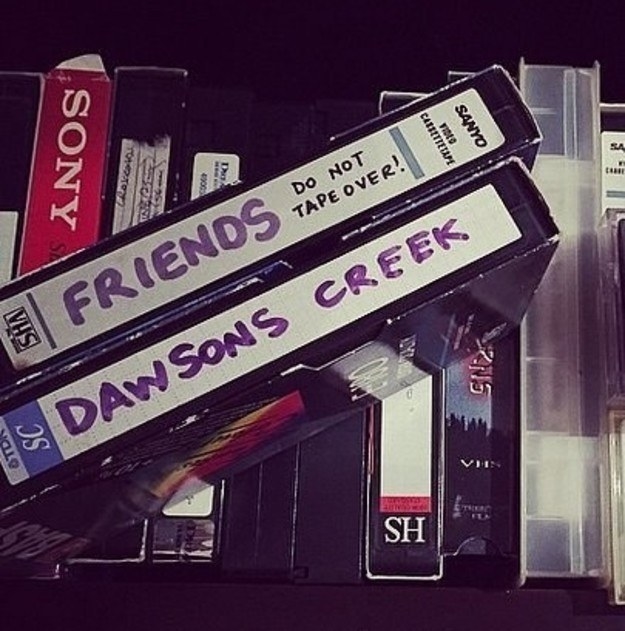 A photo of two blank VHS tapes one labeled Friends -- Do Not Tape Over and the other Dawson&#x27;s Creek