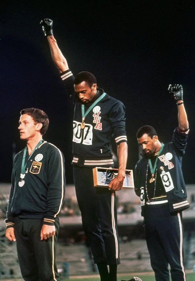Tommie Smith (center) and John Carlos of the USA each extend a gloved fist in racial protest in 1968.