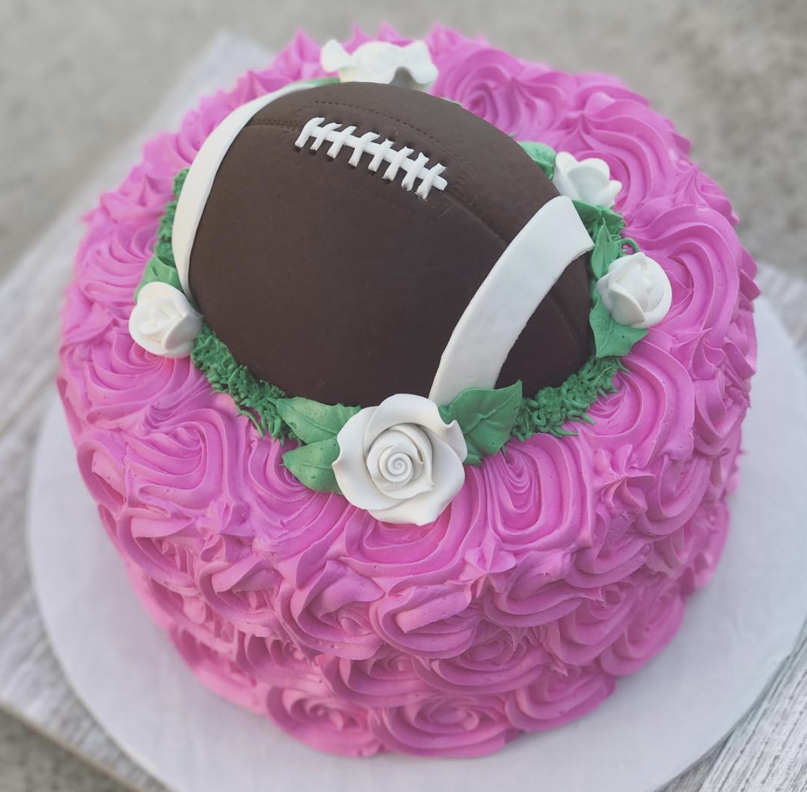 stunning pink cake with football fondant