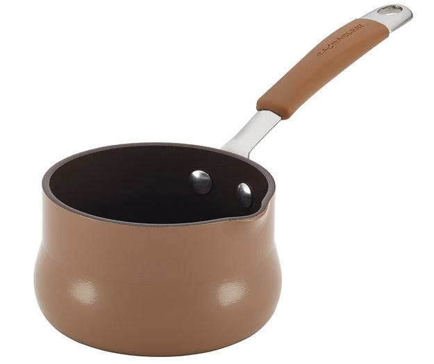 A hard porcelain butter warmer with a pour spout for effortless drizzling.