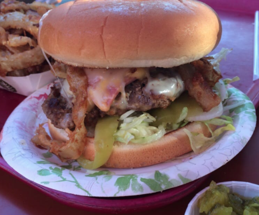 A thick burger on a plate