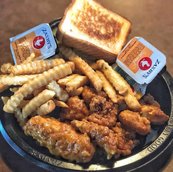 Fries and chicken fingers on a plate