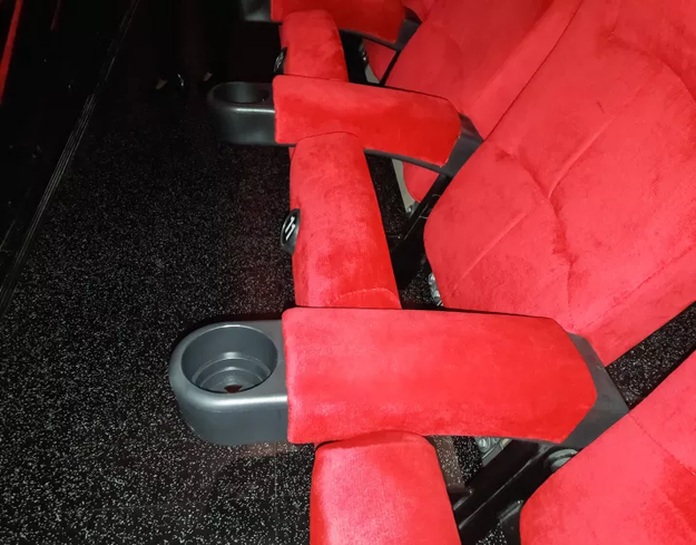 Movie theater seats have only had cupholders since the '80s.