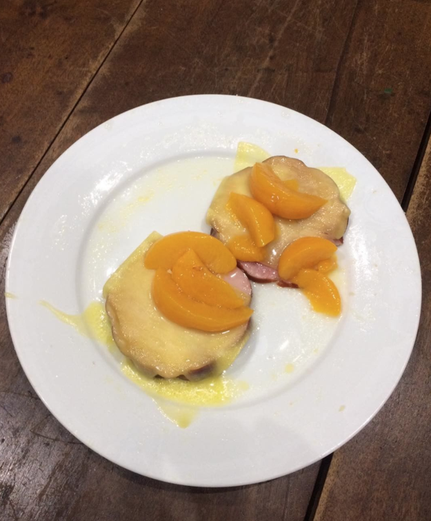 This person who enjoys ham and cheese...topped with peaches.