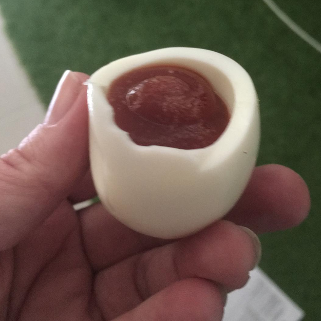 This person who boils an egg, removes the center, and replaces it with a pool of ketchup.