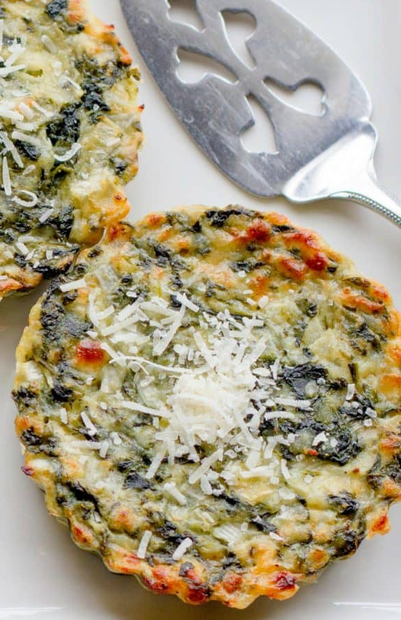 Two circular potato and spinach tarts.