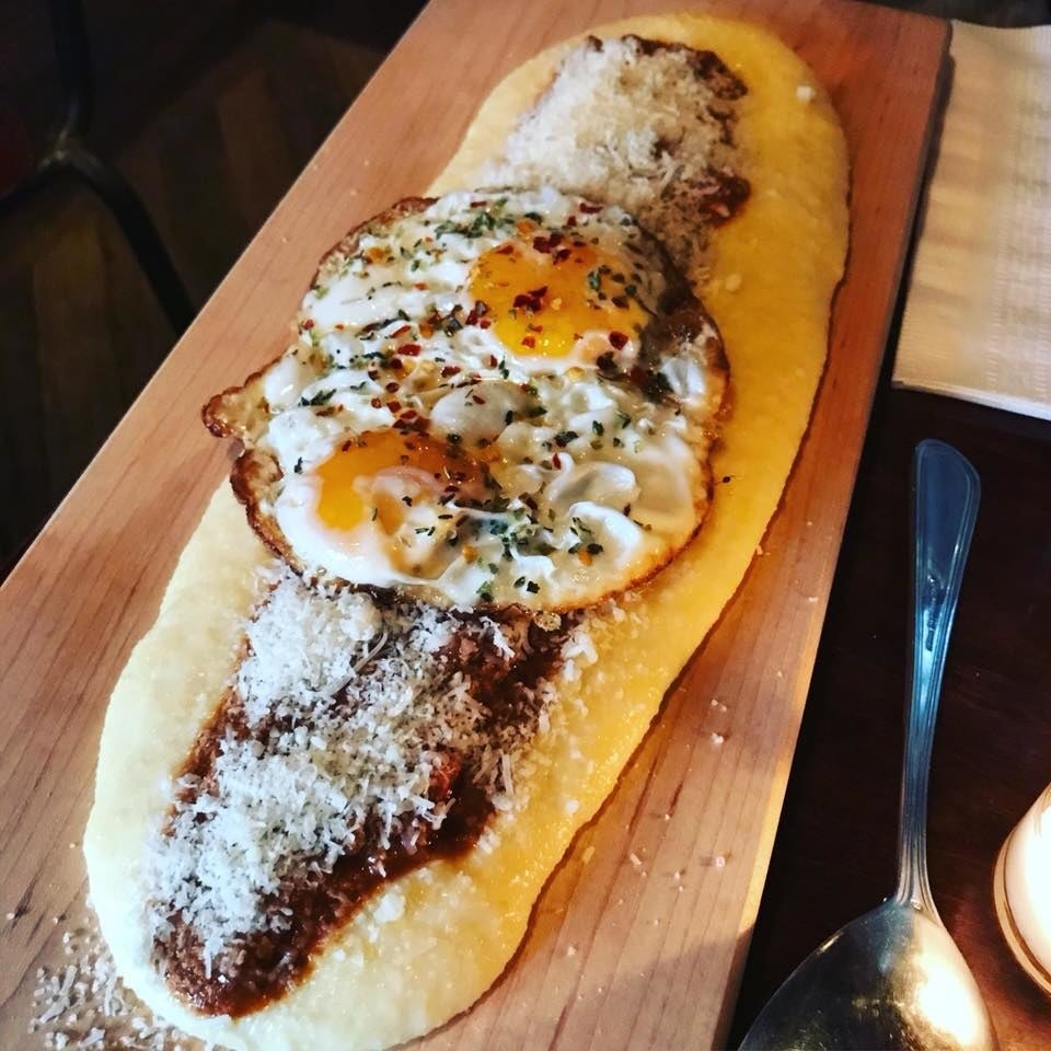 The Plank is one of the most popular house specialities. Served on a wooden plank - thus the name - the dish features hearty grass-fed beef bolognese poured over creamy, soft polenta with crispy eggs, parmesan, and a drizzle of olive oil. The dish serves 2 people, and is perfect for sharing either as a main entree or an appetizer.