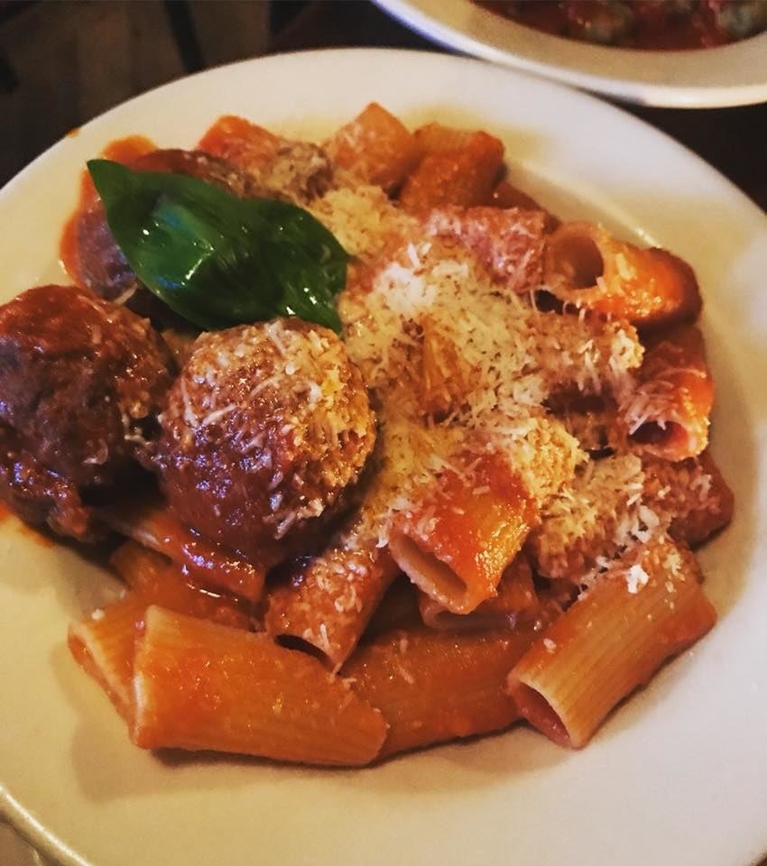 The Grandmother's Tomato Gravy sauce - meaty and hearty - is paired with perfectly al dante rigatoni pasta with succulent Italian sausage and juicy beef meatballs, all topped with snow-like parmesan.
