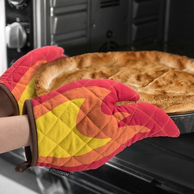 A pair of flame oven mitts that can handle the hottest of dishes. They look like FIRE, literally.