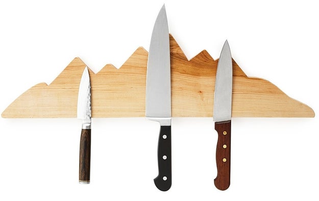 A magnetic wooden knife rack sure to ~peak~ anyone's interest.