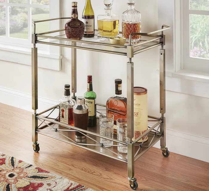 Promising review: “I’ve been searching for the right bar cart for more than a year because I'm very picky. I found this and thought it would be the right color to compliment the decor in my dining room. It arrives in one large box and you have to screw on the wheels, the four legs, and the top. The tempered glass is boxed separately, and you'll have to place it on top once you have assembled the bar. It rolls without any issue and it's big enough to place a lot of things on it.” —OstkUser24791169Price: $192.99