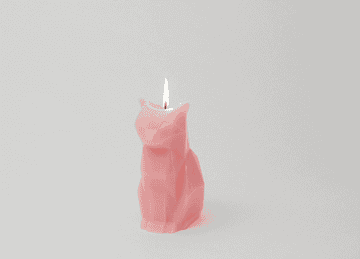 gif of geometric pink cat candle that melts to show metal skeleton underneath