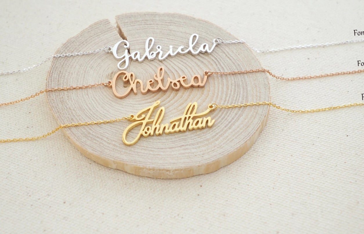 personalized necklaces reading gabriela, chelsea, and johnathan in three different metals 