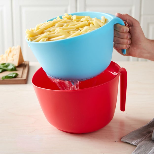 Don't *strain* yourself when it comes to making pasta. Use this colander and bowl set that fits perfectly together (hello, storage solutions) and will help you avoid messes. All you need to do is boil water and eat — I BELIEVE in you.