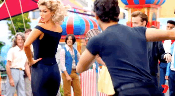 I've always loved Sandy's "I'm a bad bitch now", carnival look.