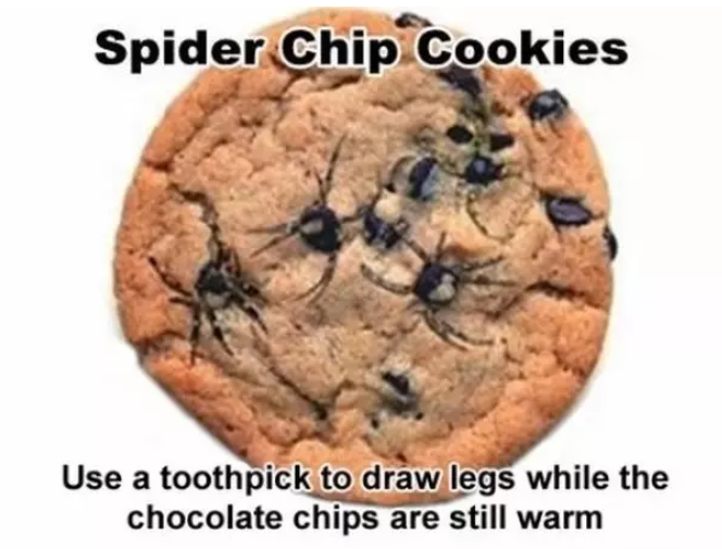 Cookie with chocolate chips arranged to resemble spiders; text suggests using toothpick to draw legs while the chips are still warm