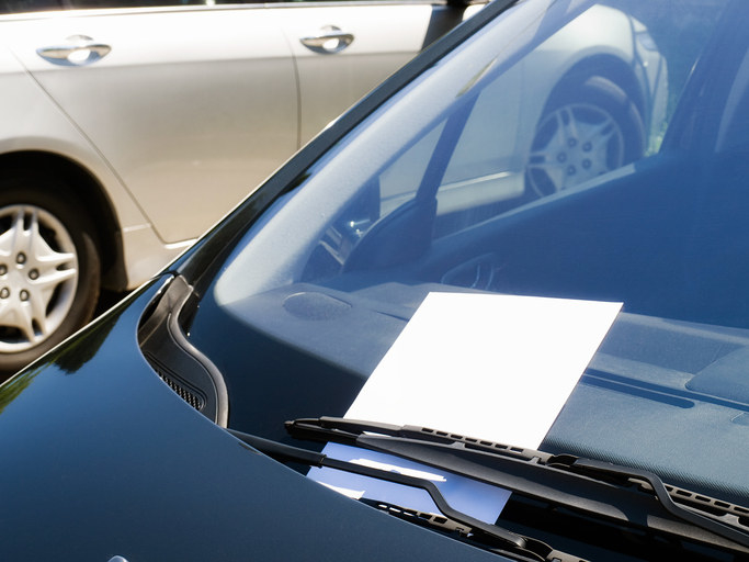 Blank piece of paper on a car&#x27;s windshield