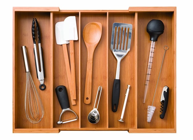 A gorgeous expandable bamboo cutlery drawer so you'll never have to dig through a pile of utensils again just to find that dang spatula again.